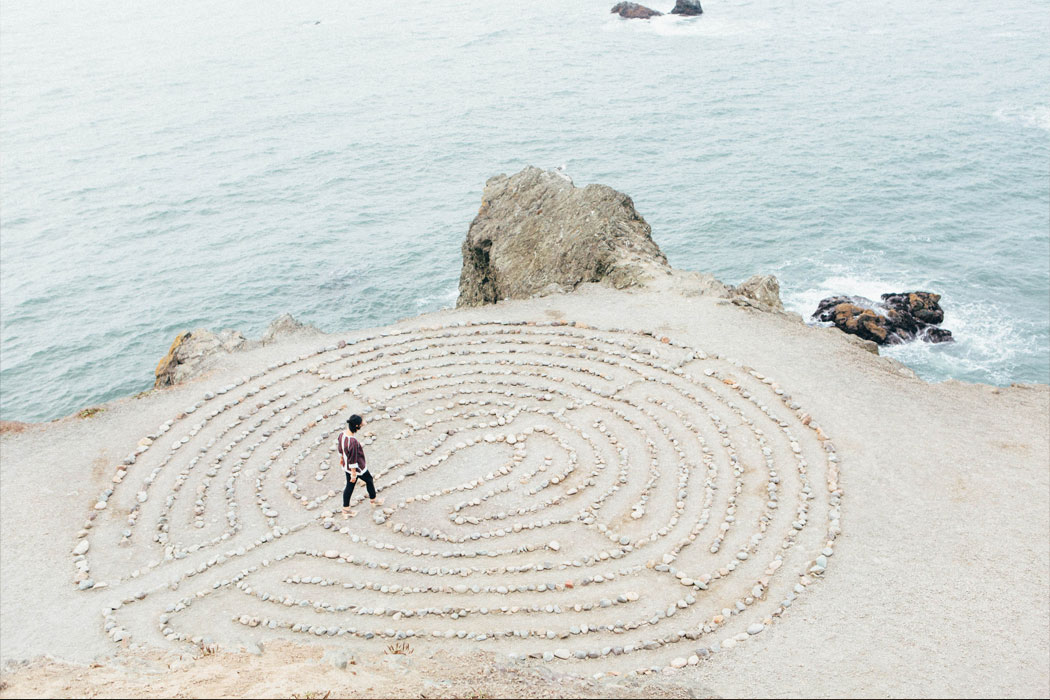 woman walking in stone maze