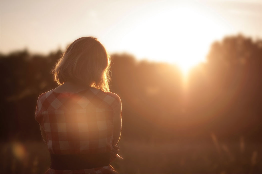 woman staring into the sun